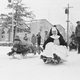 Sister Monica rides a sled with children